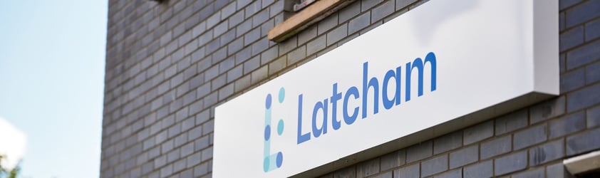 The Latcham logo on a building.